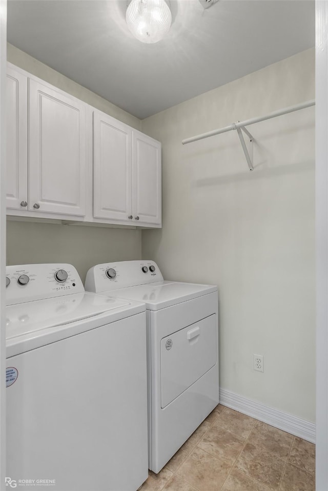 washroom with cabinets and separate washer and dryer