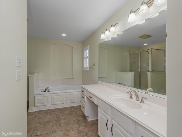 bathroom with vanity and plus walk in shower