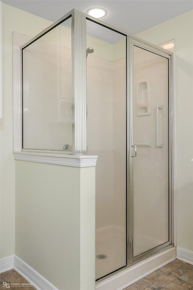 bathroom featuring an enclosed shower