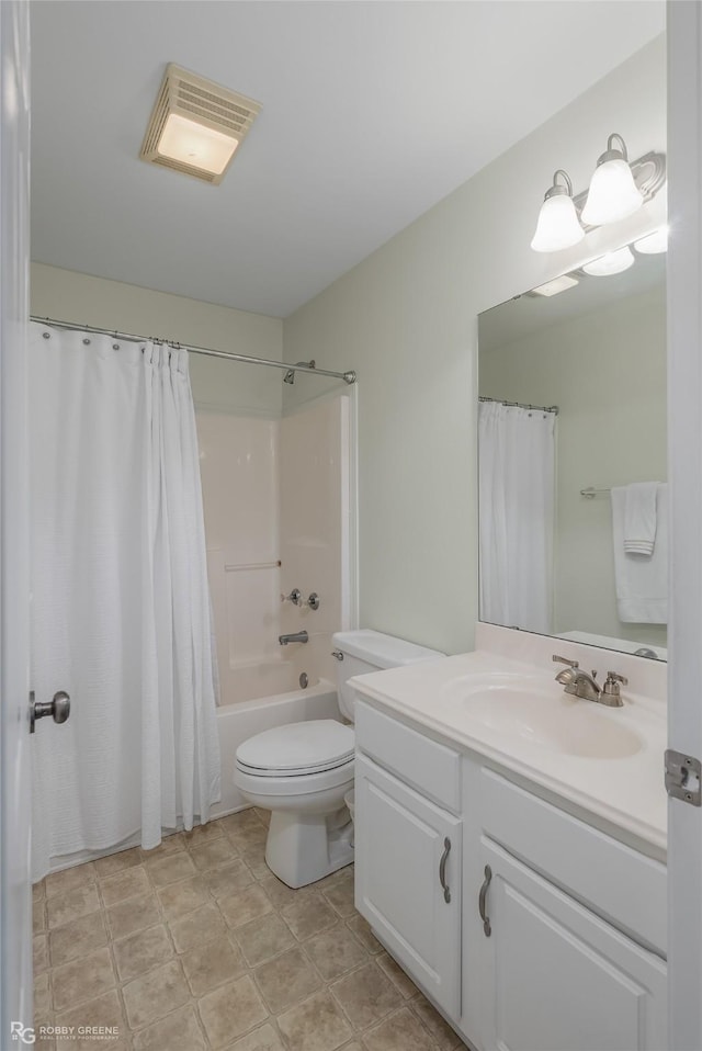 full bathroom with vanity, toilet, and shower / bath combo