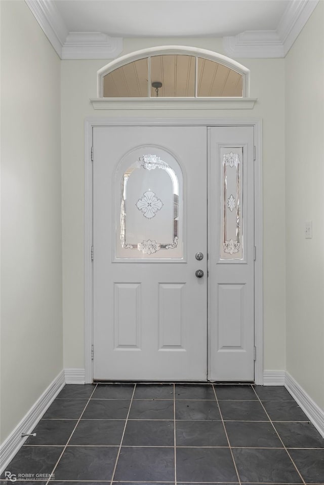 tiled entrance foyer featuring crown molding