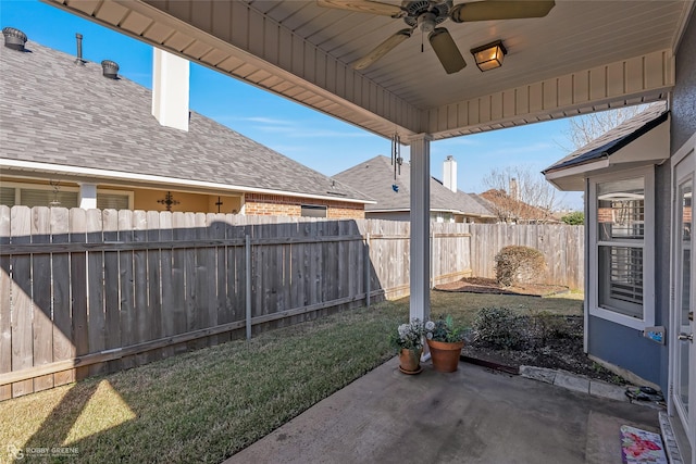 view of yard featuring a patio area and ceiling fan