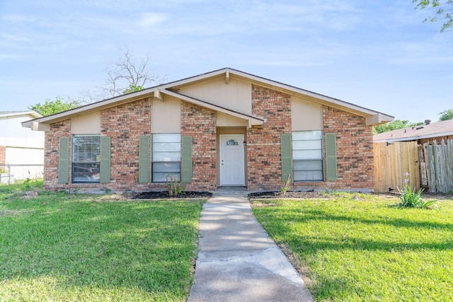 single story home featuring a front lawn