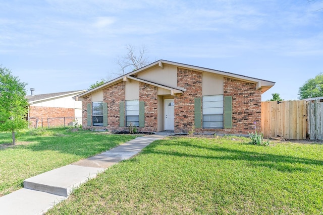 ranch-style home with a front yard