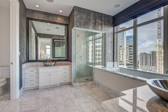 full bathroom with independent shower and bath, vanity, and toilet