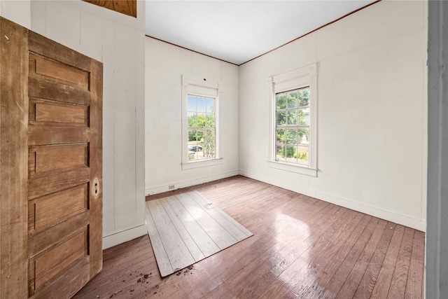 unfurnished room featuring wood-type flooring