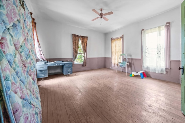 interior space with light wood-type flooring and ceiling fan