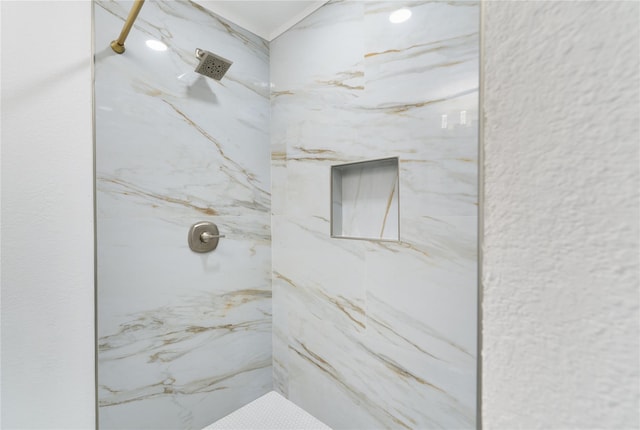 bathroom featuring tiled shower