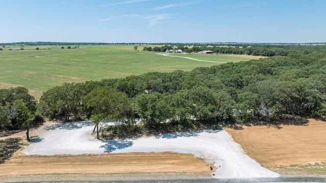 birds eye view of property with a rural view