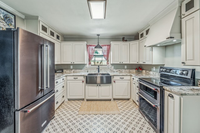 kitchen featuring sink, custom exhaust hood, light tile patterned floors, stainless steel appliances, and white cabinets