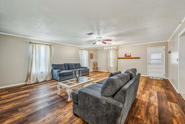 living room featuring ceiling fan, ornamental molding, and hardwood / wood-style flooring