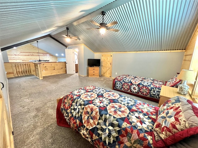 carpeted bedroom featuring ceiling fan, vaulted ceiling, and wood walls