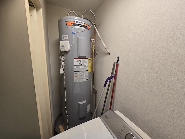 utility room featuring electric water heater