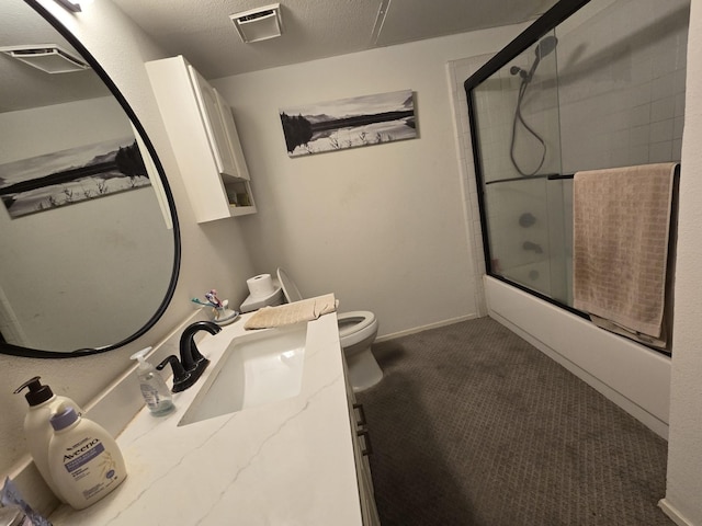 bathroom with a textured ceiling, toilet, shower / bath combination with glass door, visible vents, and baseboards