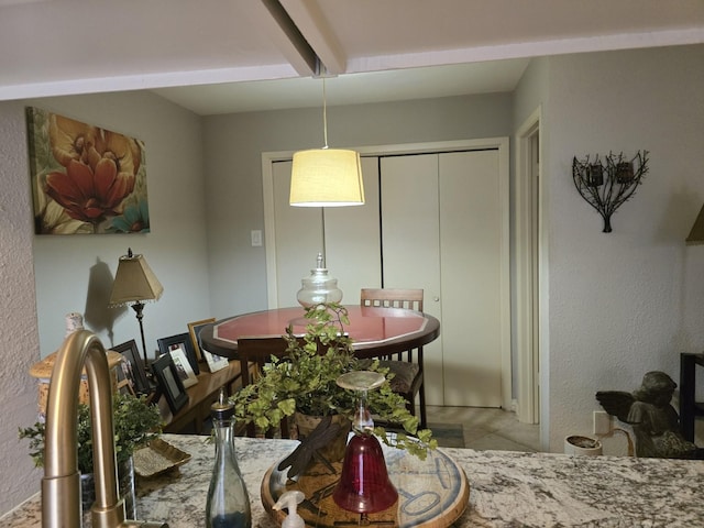 dining room with beamed ceiling