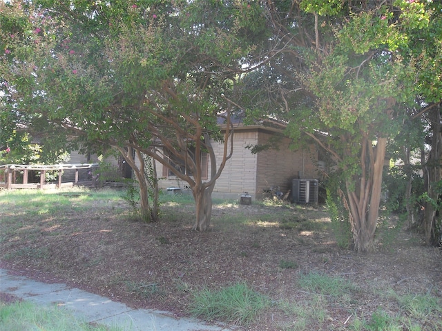 view of home's exterior with central AC unit