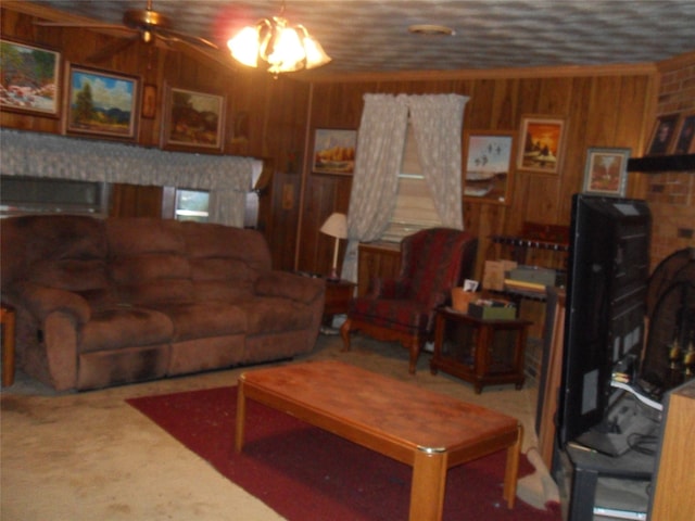 carpeted living room with wood walls and ceiling fan