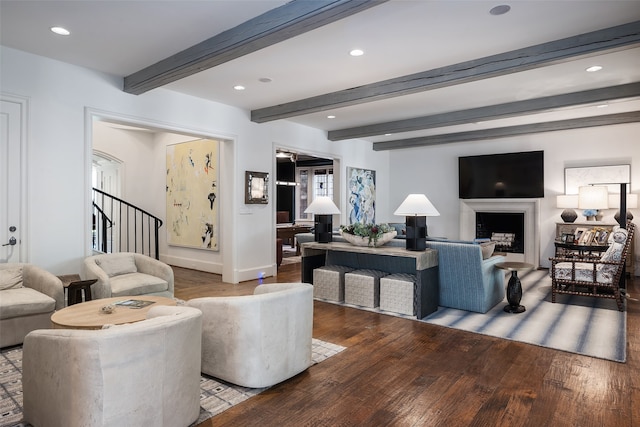 living room with beam ceiling and hardwood / wood-style floors