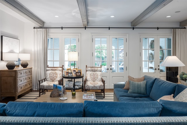 living room featuring hardwood / wood-style floors, beam ceiling, and french doors