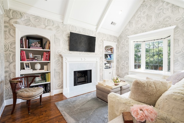 living room with beamed ceiling, dark hardwood / wood-style floors, high vaulted ceiling, and built in shelves