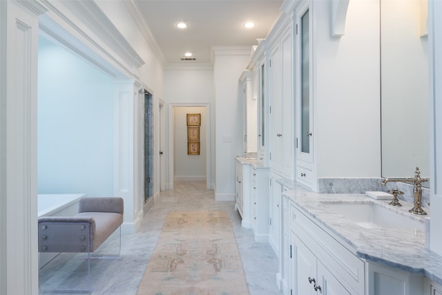 bathroom with ornamental molding, tile patterned floors, and vanity