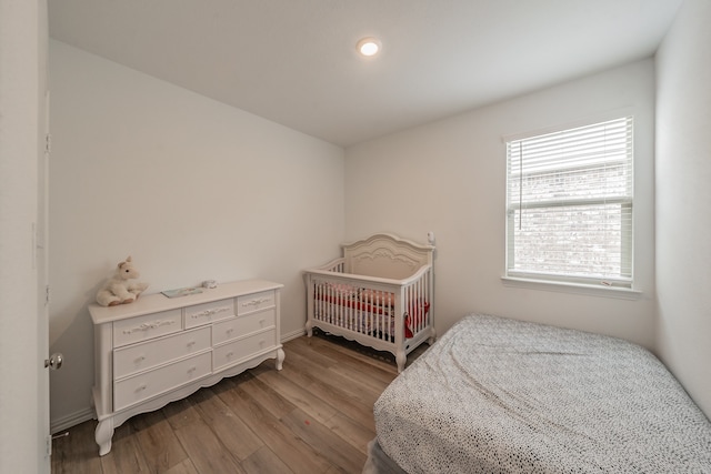 bedroom featuring hardwood / wood-style flooring