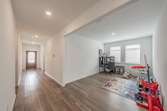 recreation room with wood finished floors, visible vents, recessed lighting, and baseboards