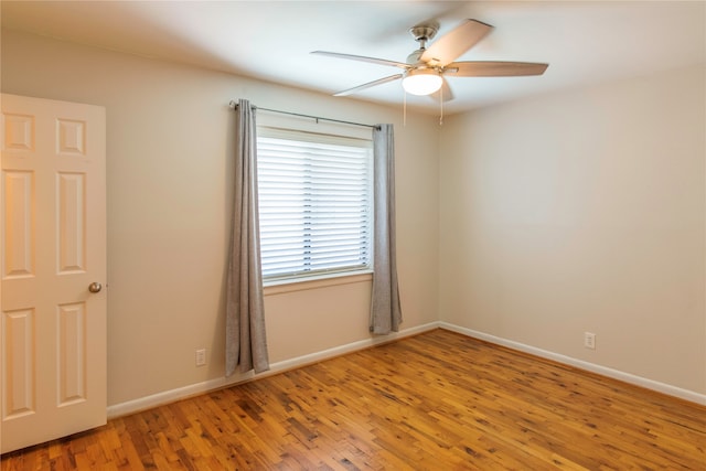 empty room featuring ceiling fan and light hardwood / wood-style floors