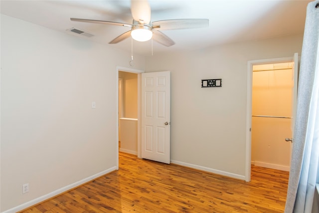 unfurnished bedroom featuring a closet, ceiling fan, and light hardwood / wood-style floors