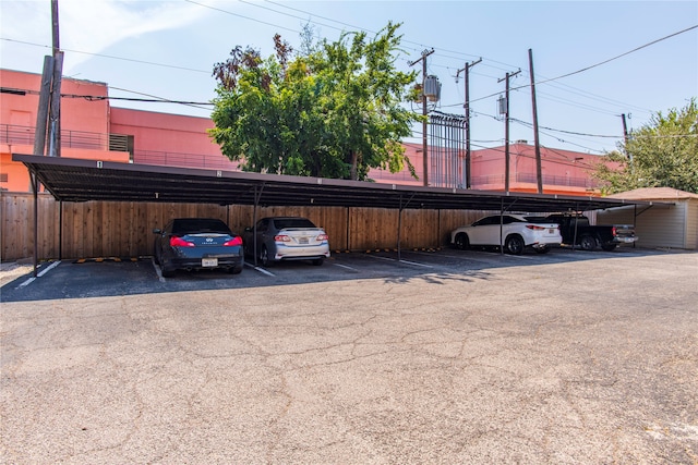 view of parking / parking lot with a carport