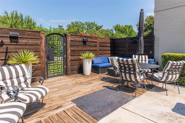 wooden deck with outdoor lounge area