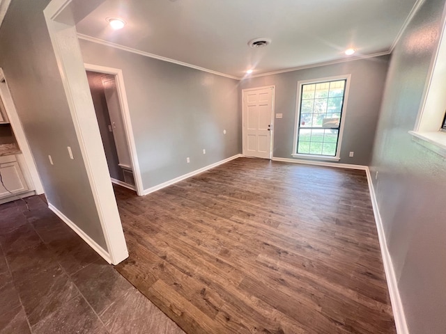 unfurnished room featuring ornamental molding and dark hardwood / wood-style floors