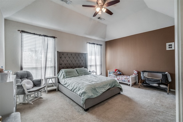 carpeted bedroom featuring ceiling fan and vaulted ceiling