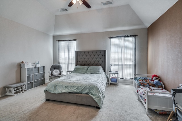 bedroom featuring ceiling fan, carpet floors, vaulted ceiling, and multiple windows