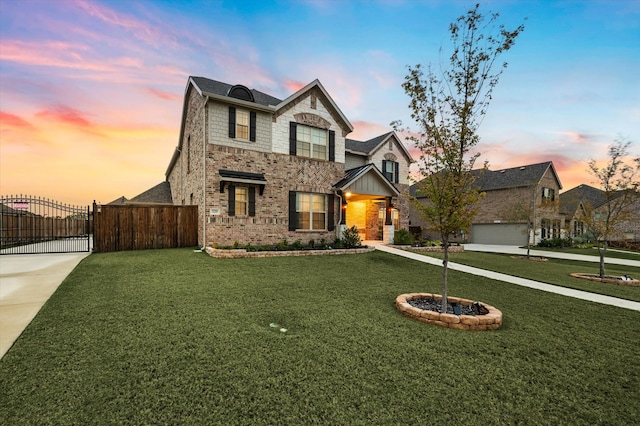 craftsman inspired home with a garage and a yard