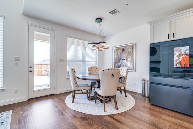 dining area featuring a chandelier and hardwood / wood-style flooring