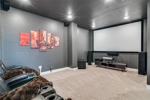 carpeted cinema room with a textured ceiling