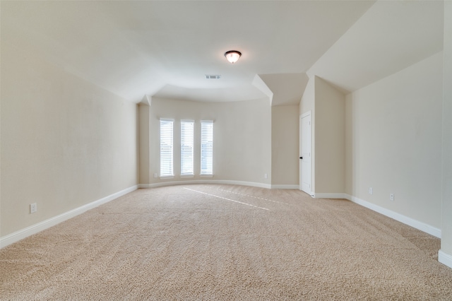 bonus room featuring light colored carpet