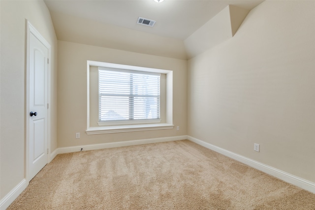 empty room with light colored carpet