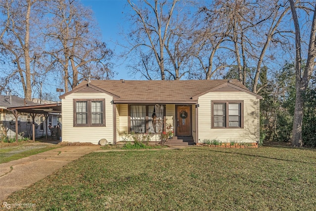 view of front of house with covered porch, a front yard, and a carport