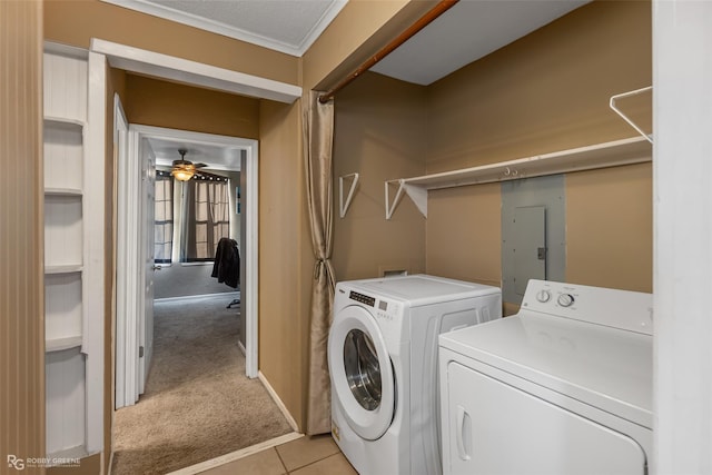 clothes washing area with electric panel, ornamental molding, ceiling fan, light carpet, and washer and clothes dryer