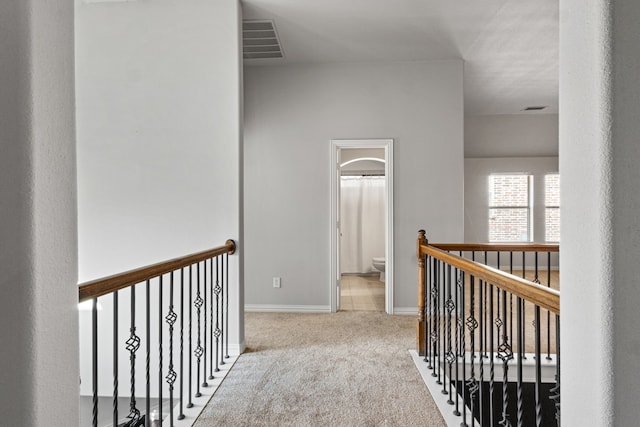 hallway with carpet floors