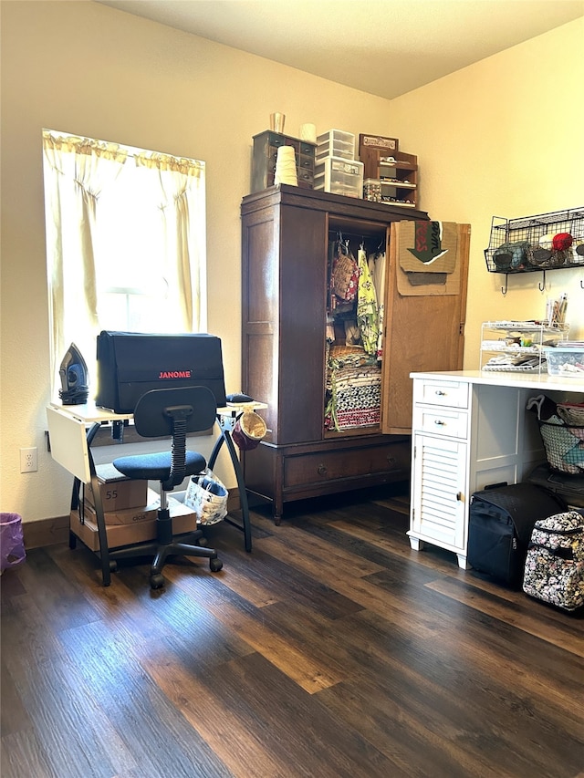 home office with dark hardwood / wood-style floors