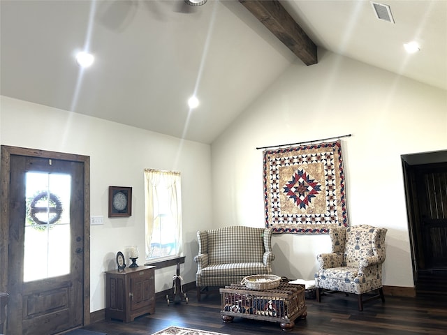 living room featuring vaulted ceiling with beams, dark wood-type flooring, and a healthy amount of sunlight