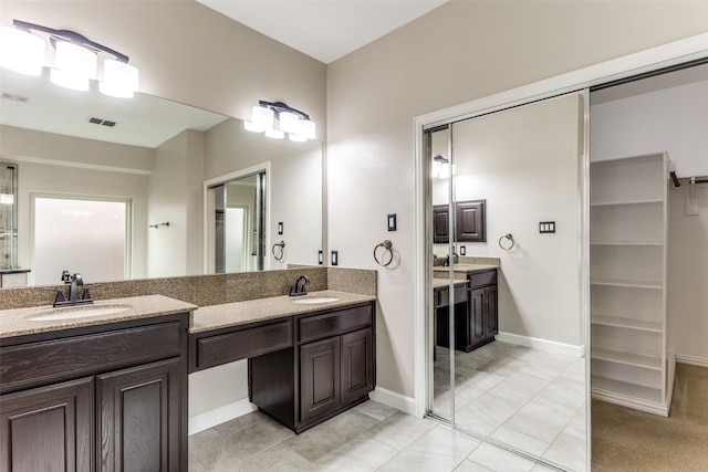 bathroom featuring vanity and tile patterned floors