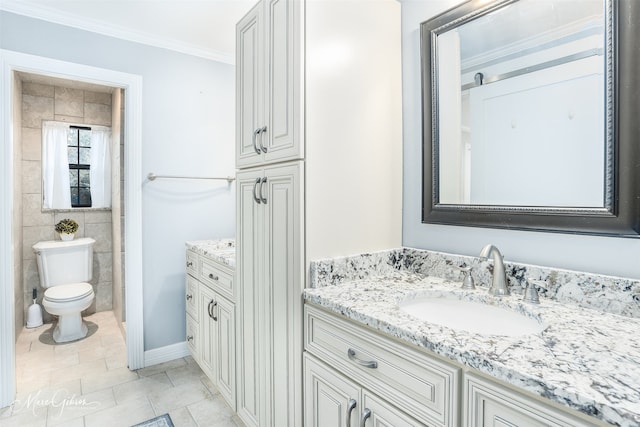 bathroom featuring tile patterned floors, toilet, vanity, crown molding, and tile walls