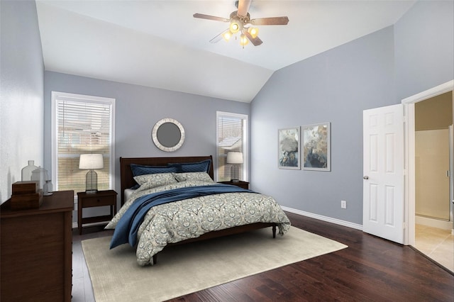 bedroom featuring lofted ceiling, dark wood-style flooring, ceiling fan, and baseboards