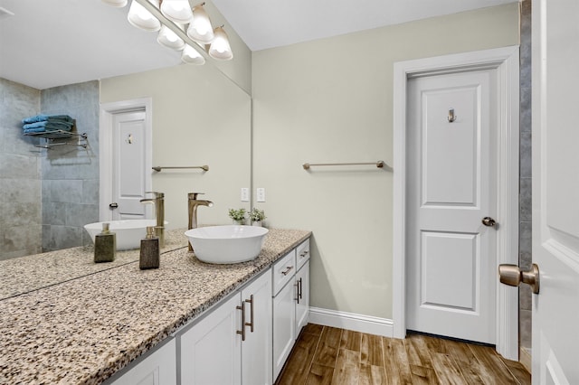 bathroom featuring hardwood / wood-style floors and vanity