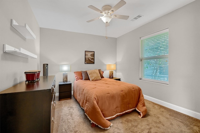 bedroom with light colored carpet and ceiling fan