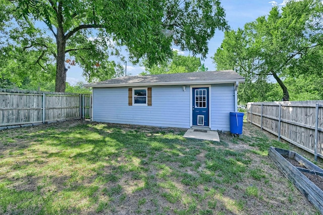 view of outbuilding featuring a lawn